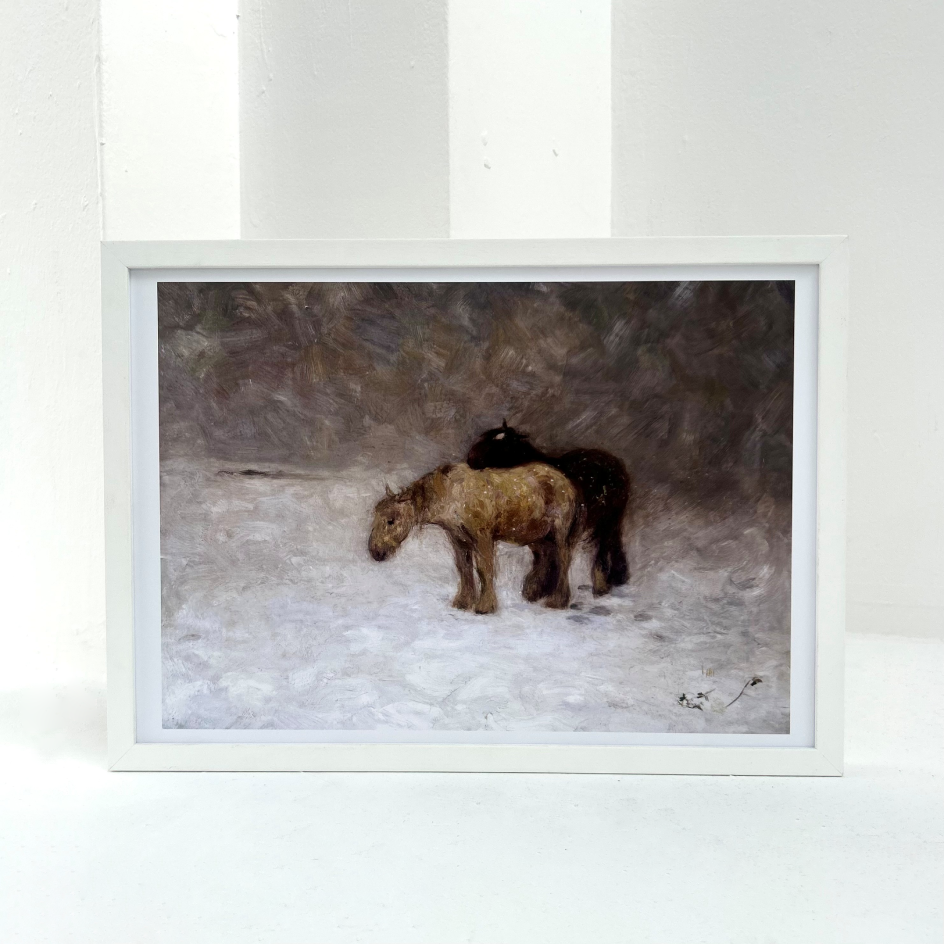 A print of Edward Stott's Snow Storm in a white frame against a white wall.