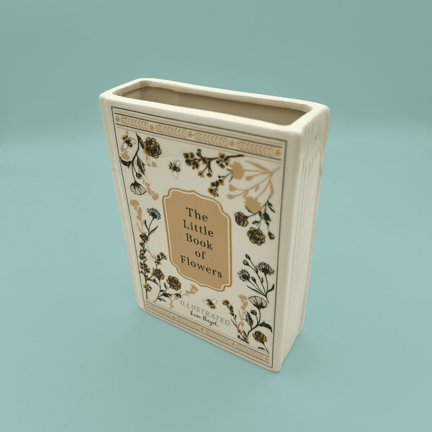 Decorative vase with 'The Little Book of Flowers' design on a light blue background
