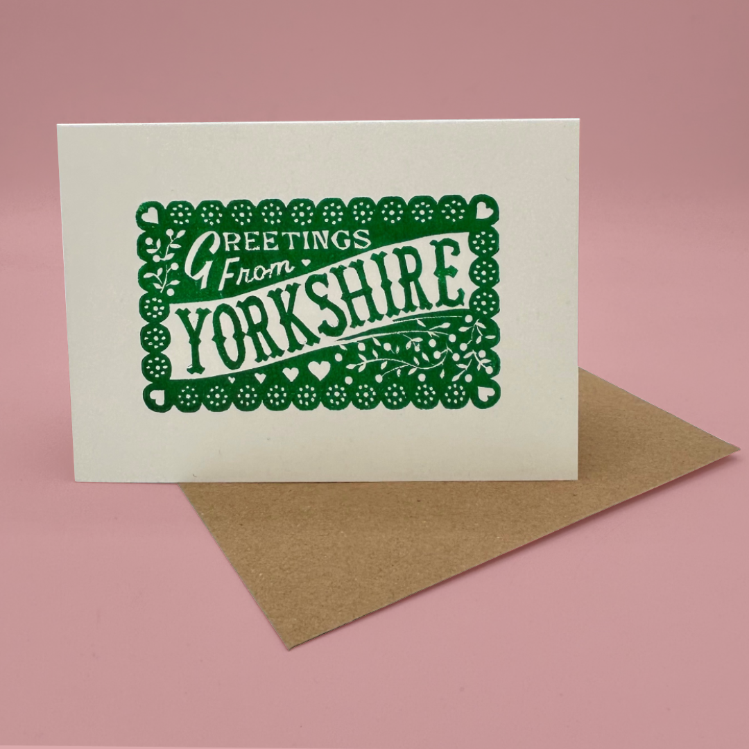 Greeting card with 'Greetings from Yorkshire' text on a pink background