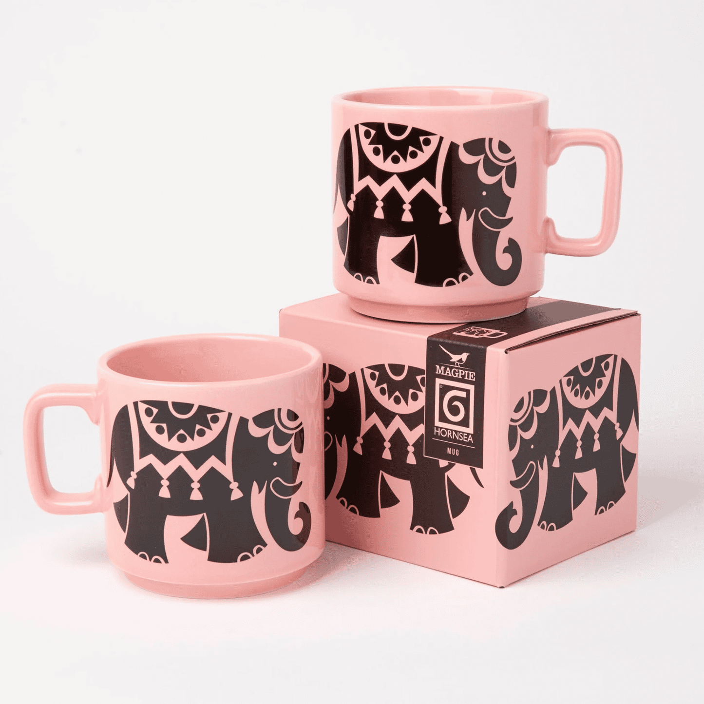 Two pink mugs with black elephant designs on a white background