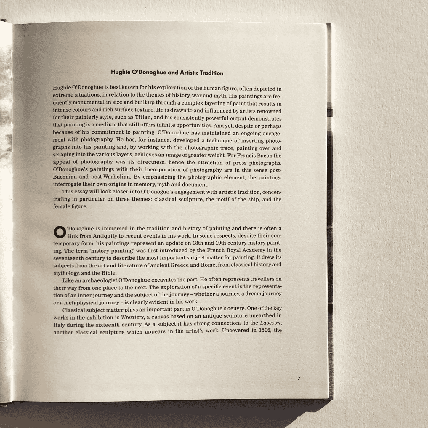 Open book with text on a plain background