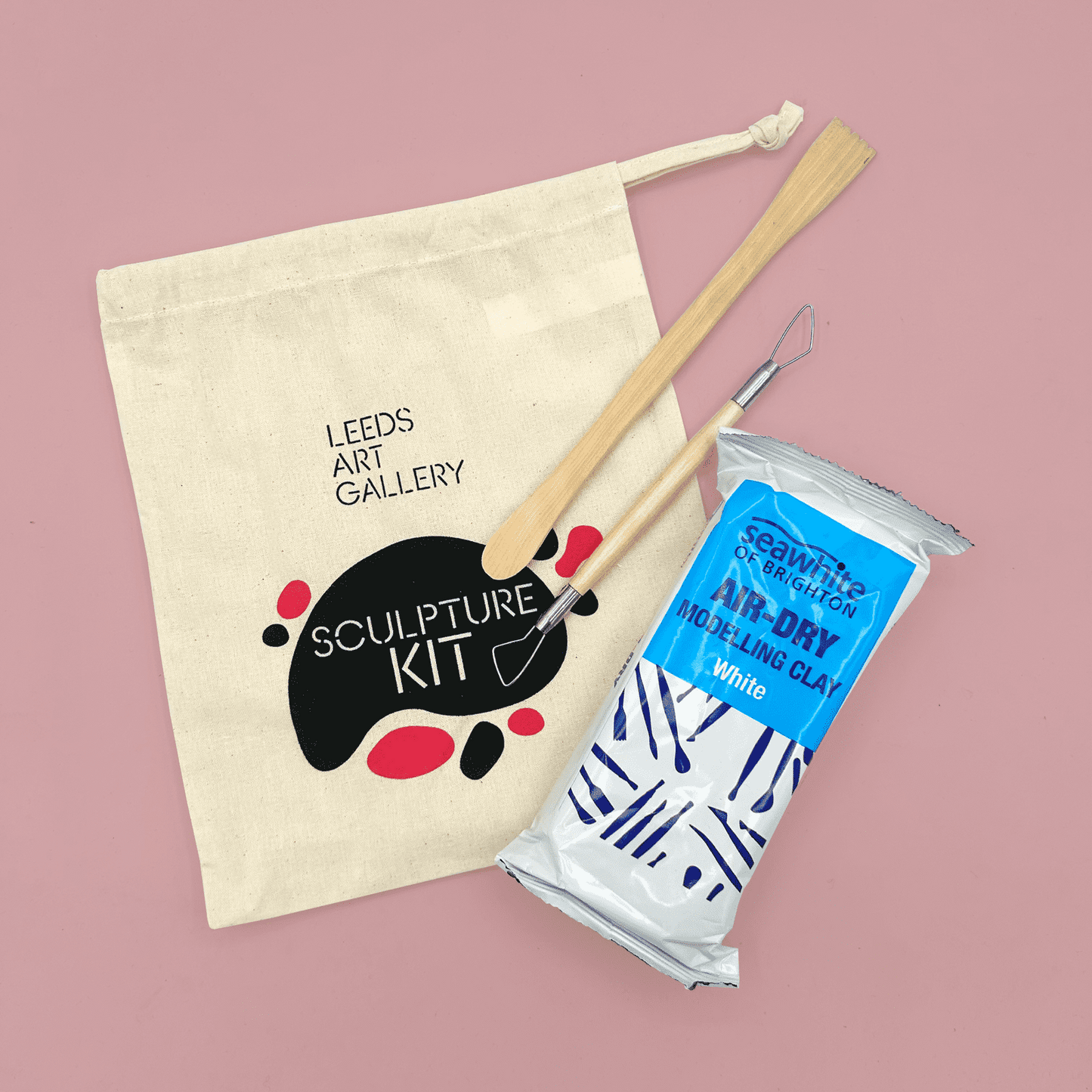 Leeds Art Gallery sculpture kit with clay and tools on a pink background