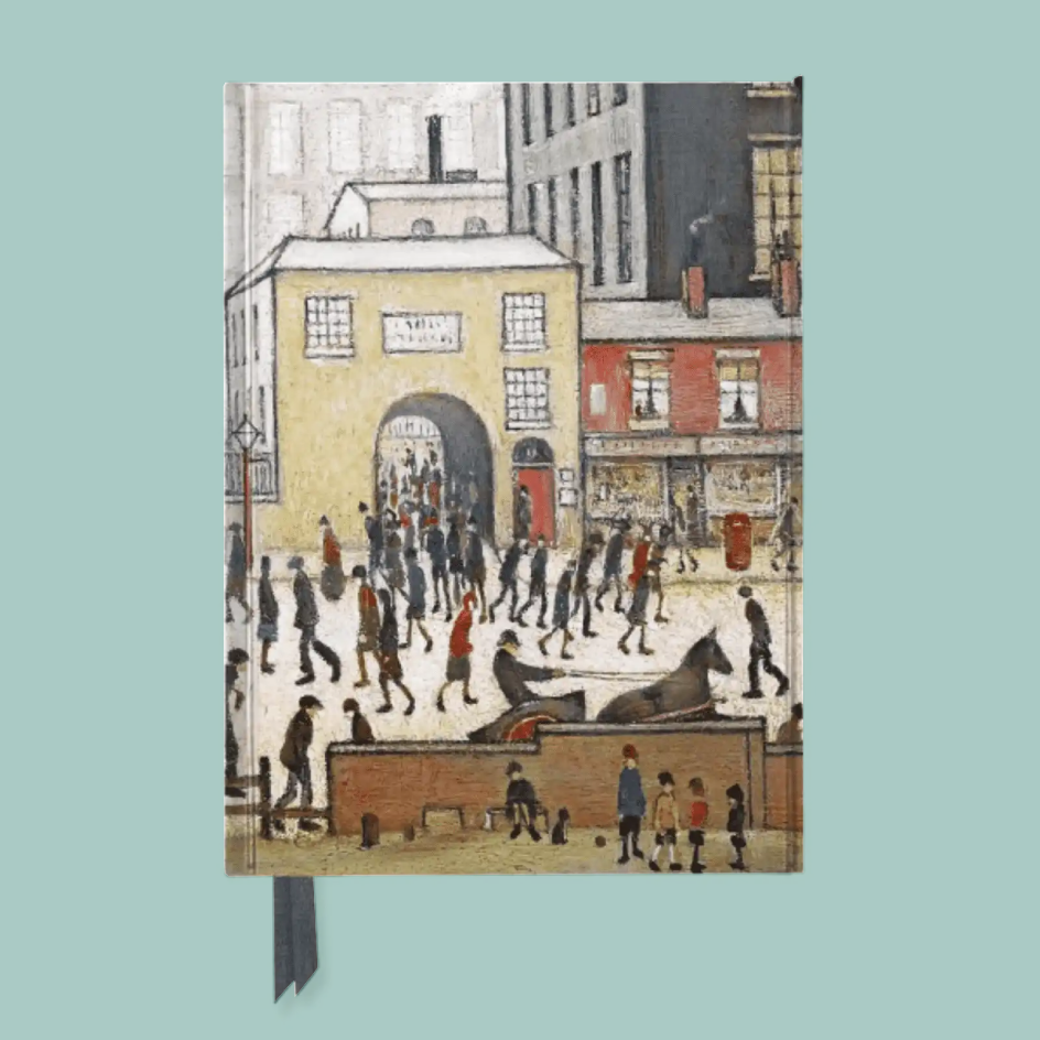 A notebook with a vintage-style illustration of a bustling street scene featuring people, horses, and buildings. The notebook has a dark gray ribbon bookmark hanging from the bottom edge and is displayed against a solid light teal background.
