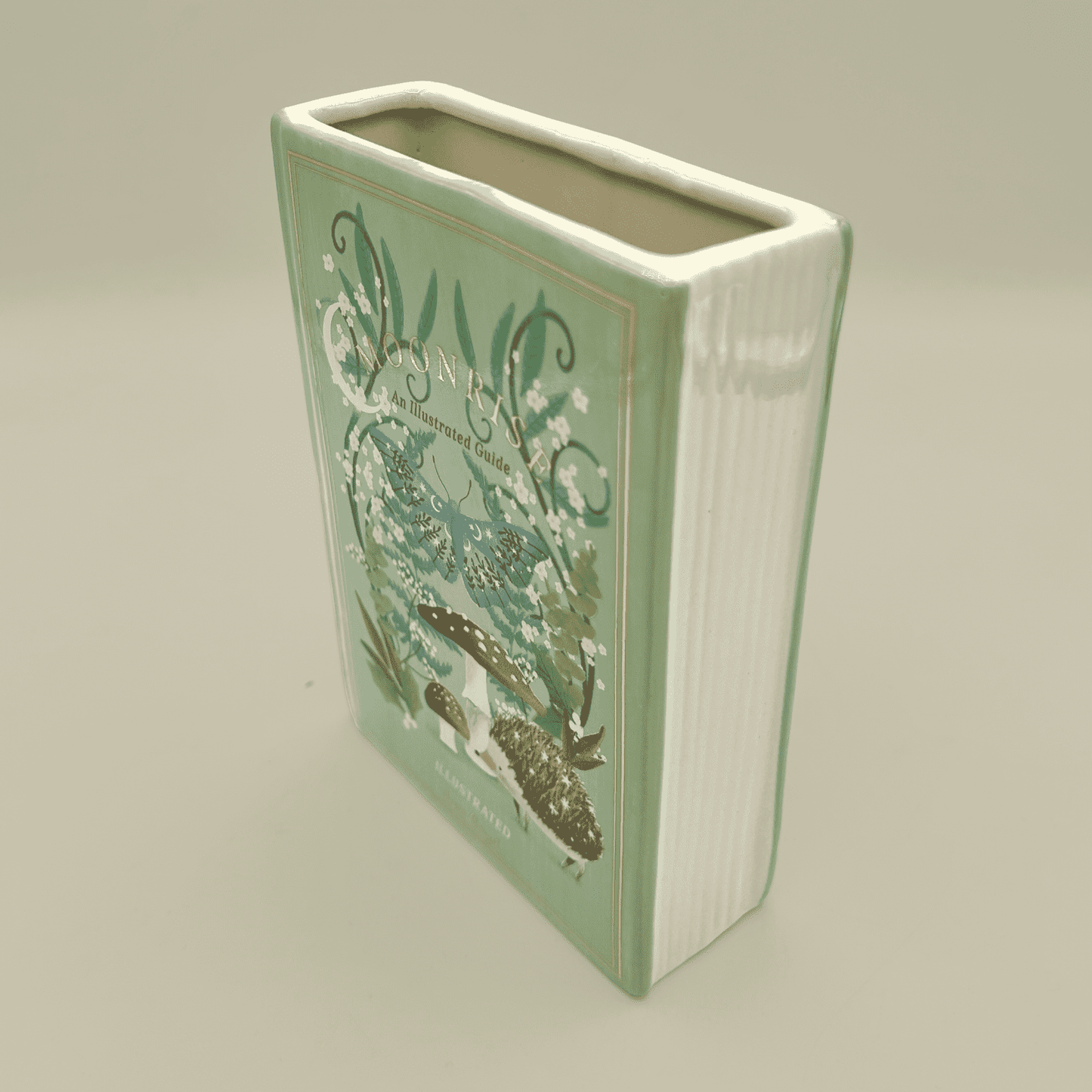 Rectangular ceramic vase with floral design on a beige background