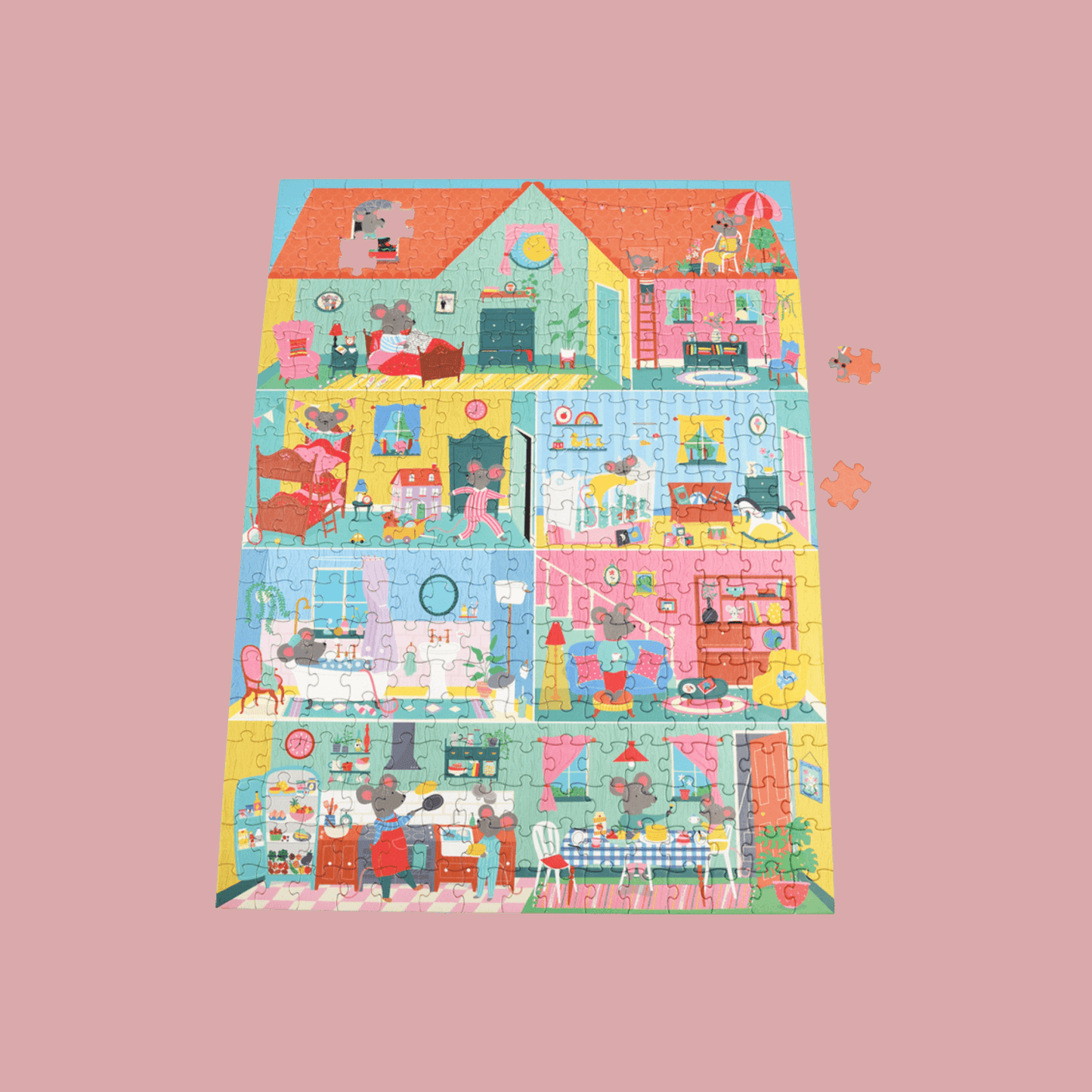 Children's puzzle with a colorful house design on a pink background