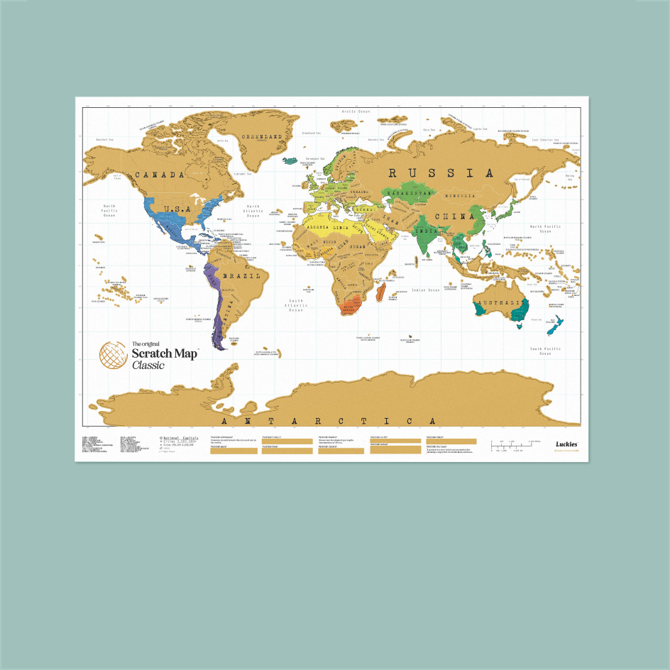 A Scratch Map Classic world map poster featuring a gold-colored landmass and a white ocean, with various regions highlighted in different colors. The poster is displayed against a solid teal background.