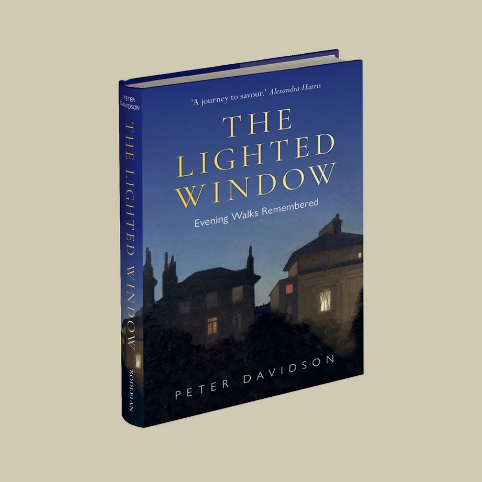 The Lighted Window: Evening Walks Remembered by Peter Davidson, a hardcover book with a dark blue cover and gold lettering, shown at an angle on a solid beige background.