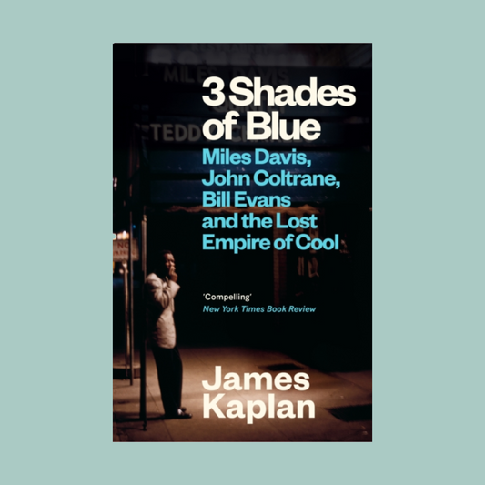 Book cover of '3 Shades of Blue' by James Kaplan with a silhouette of a person in a room.
