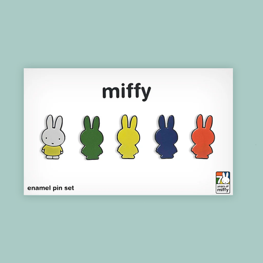 Set of five colorful enamel pins with 'miffy' branding on a light blue background
