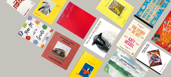 A collection of sketchbooks and books about artists on a grey background