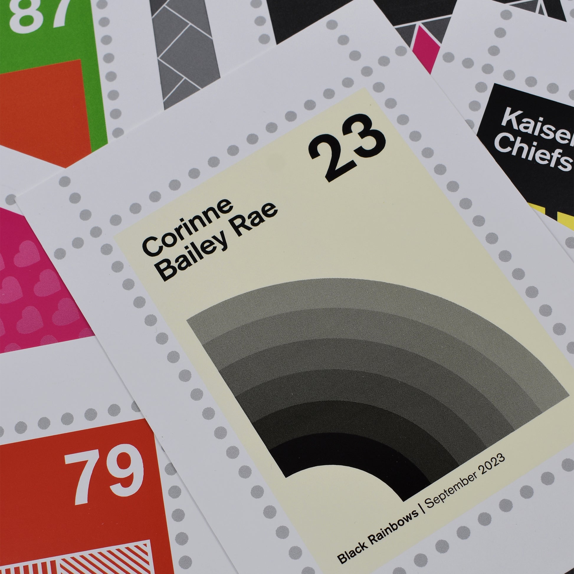 Postcard pack with 'Corinne Bailey Rae' and 'Kaiser Chiefs' text on a colorful background