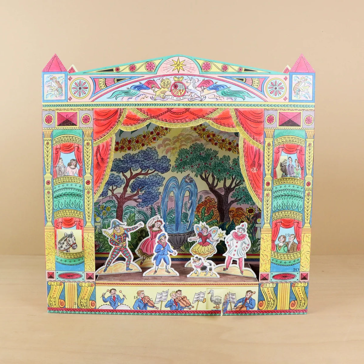 Colorful puppet theater advent calendar on a beige background