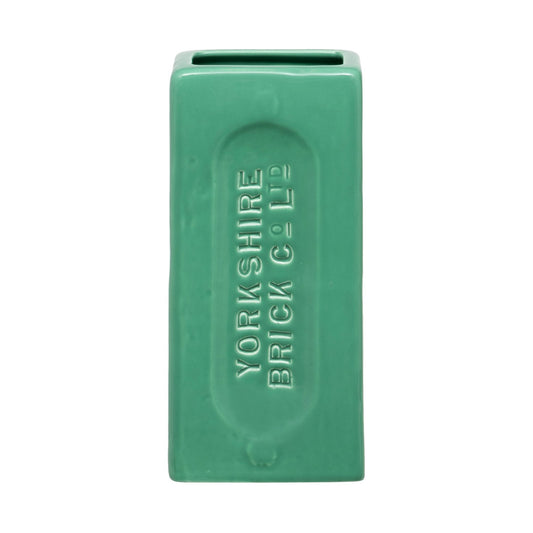 A green ceramic brick-shaped vase with 'YORKSHIRE BRICK Co Ltd' embossed on the side.