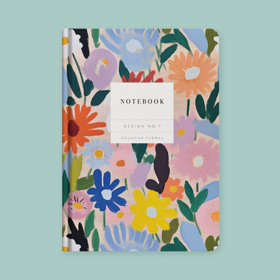 A floral notebook with a colorful abstract flower pattern on a light background, featuring a white label in the center that reads 'NOTEBOOK DESIGN NO.7 GOUACHE FLORAL'.