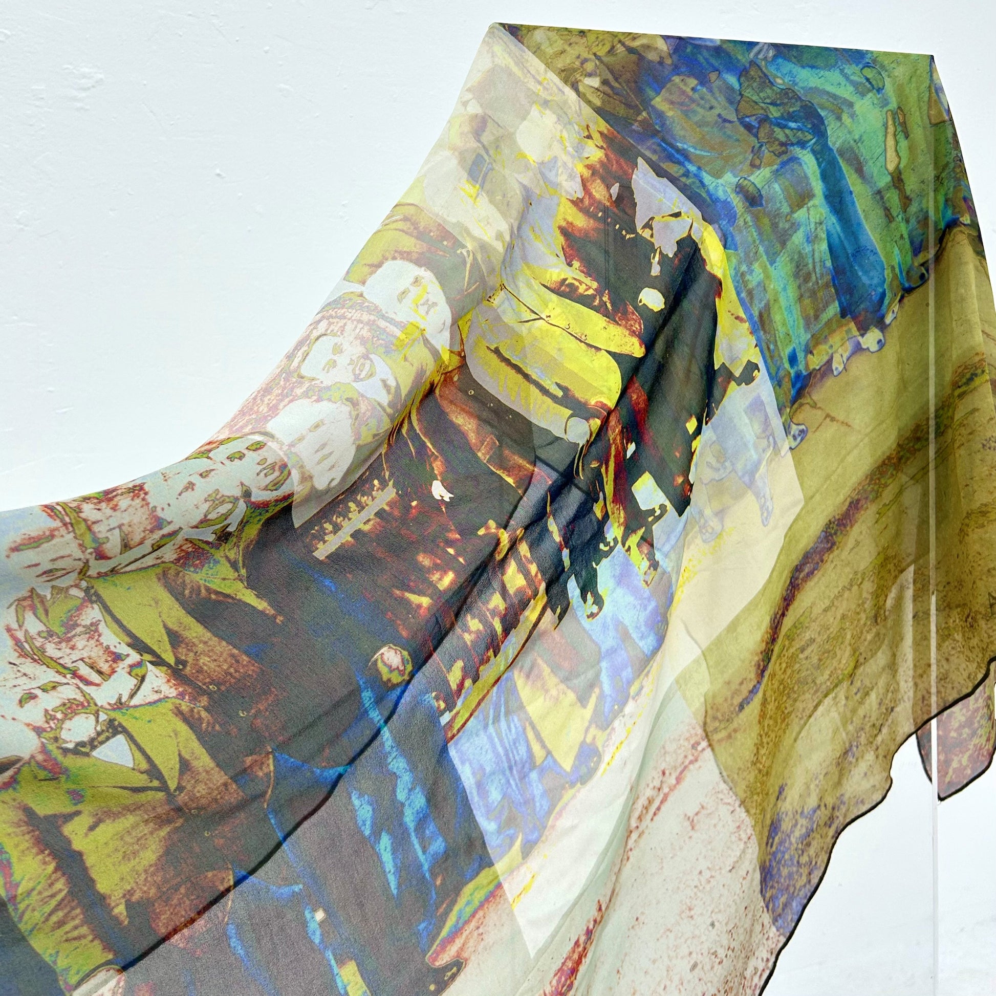 Silk scarf with a printed photograph of men on it. 