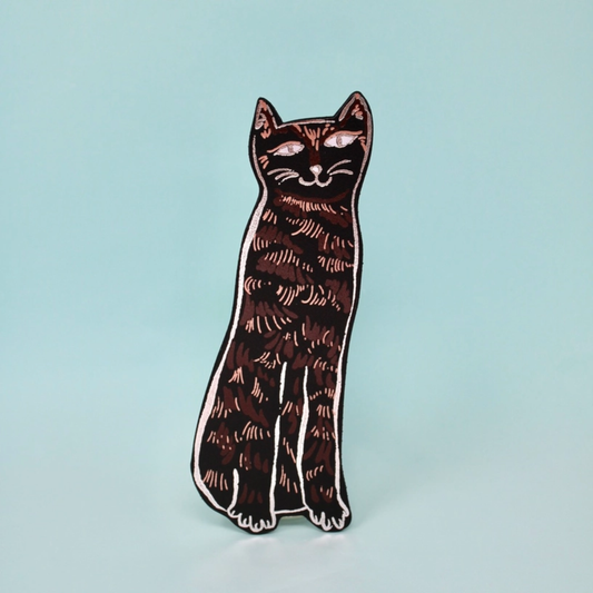Cat leather book mark with embossed foiling on a blue background