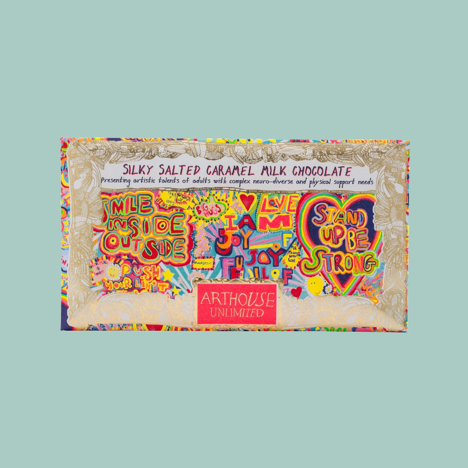 A rectangular chocolate bar package labeled 'Silky Salted Caramel Milk Chocolate' with a highly colorful, graffiti-style graphic design and the visible brand 'Arthouse Unlimited' on a light blue background.