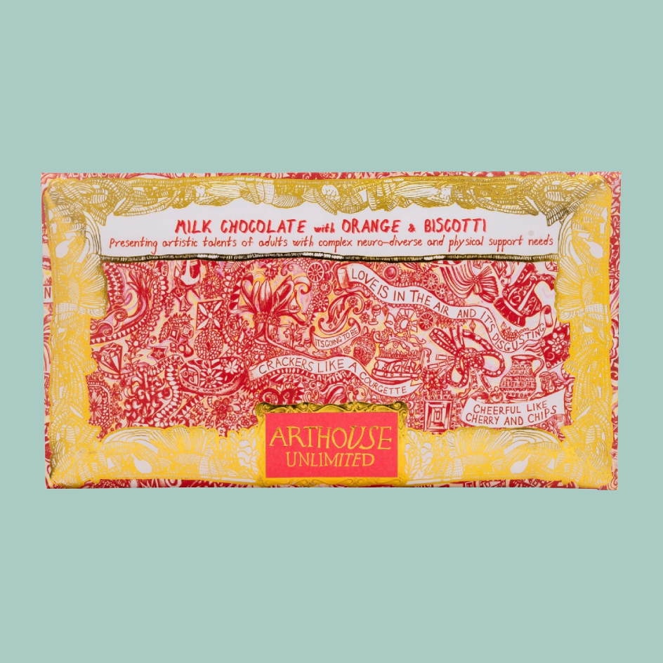 A rectangular milk chocolate bar wrapped in a decorative paper sleeve, featuring red and yellow illustrated patterns and text including 'MILK CHOCOLATE with ORANGE & BISCOTTI' and the brand 'ARTHHOUSE UNLIMITED'.