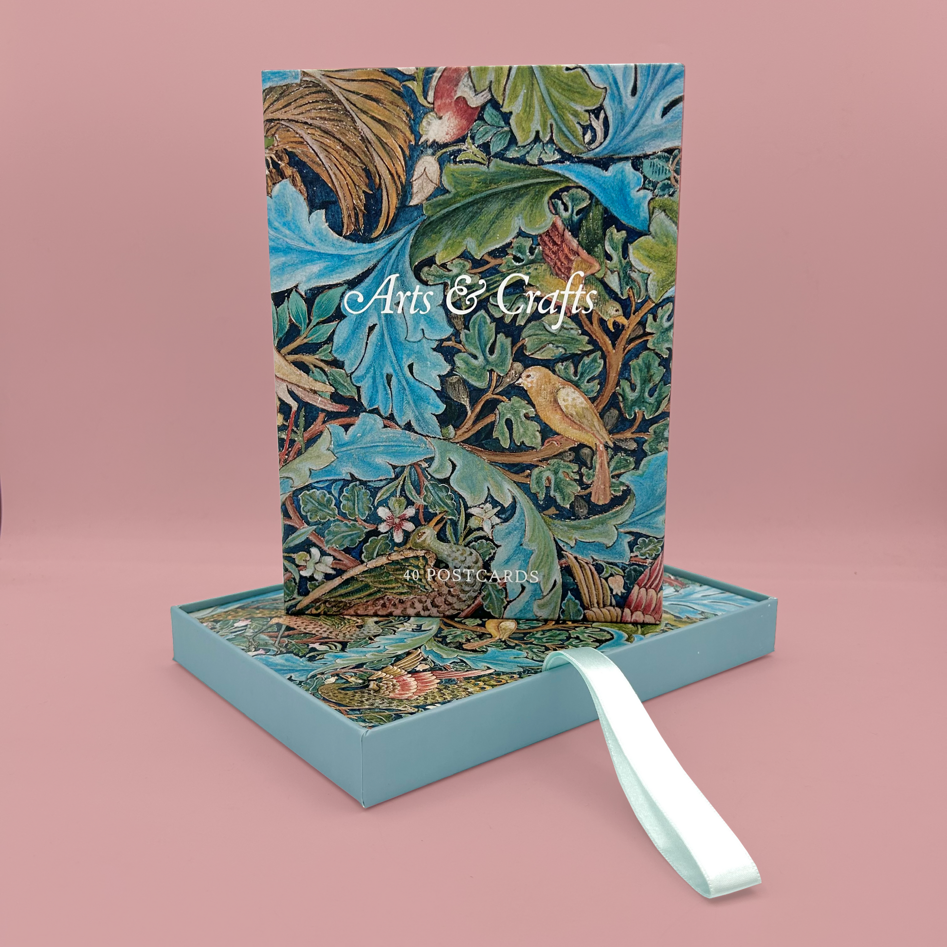 Decorative notebook with floral design and 'Arts & Crafts' text on a pink background