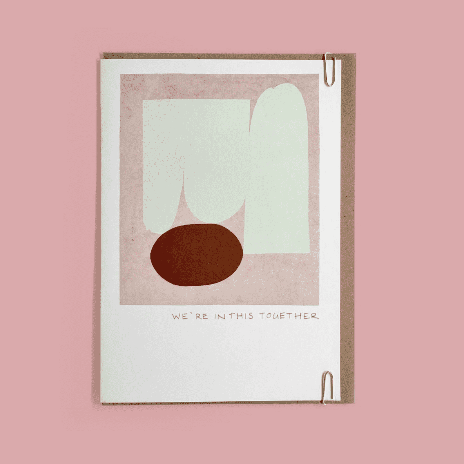 Greeting card with abstract design and 'We're In This Together' text on a pink background