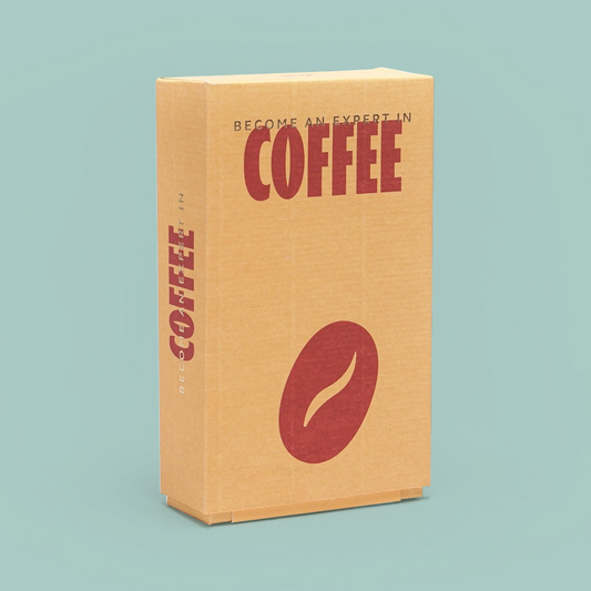 A tall rectangular cardboard box with a kraft-paper tan finish, featuring the word 'COFFEE' in large dark red letters on the front and a matching red coffee bean graphic. The side also shows the word 'COFFEE' vertically.