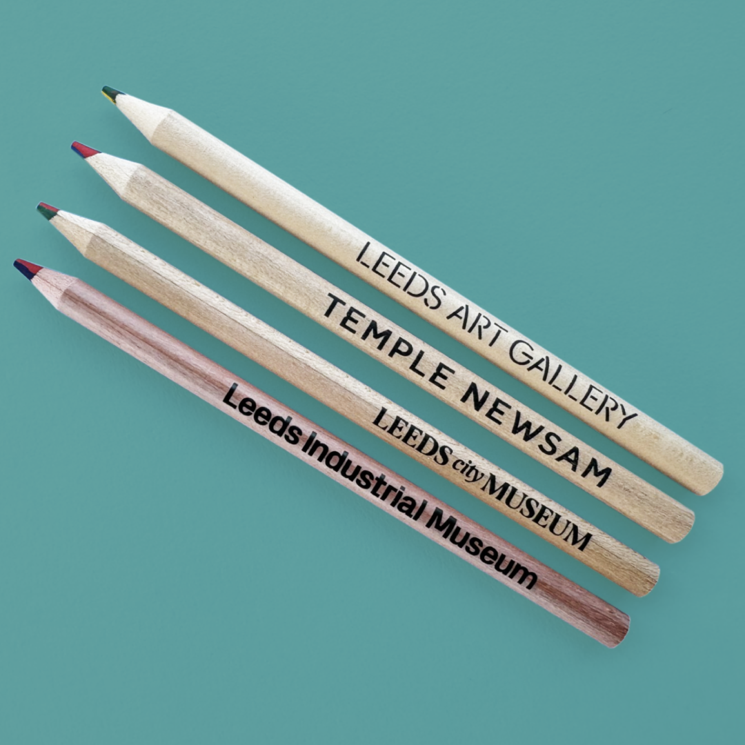 Four pencils with coloured leads and branding in black text.