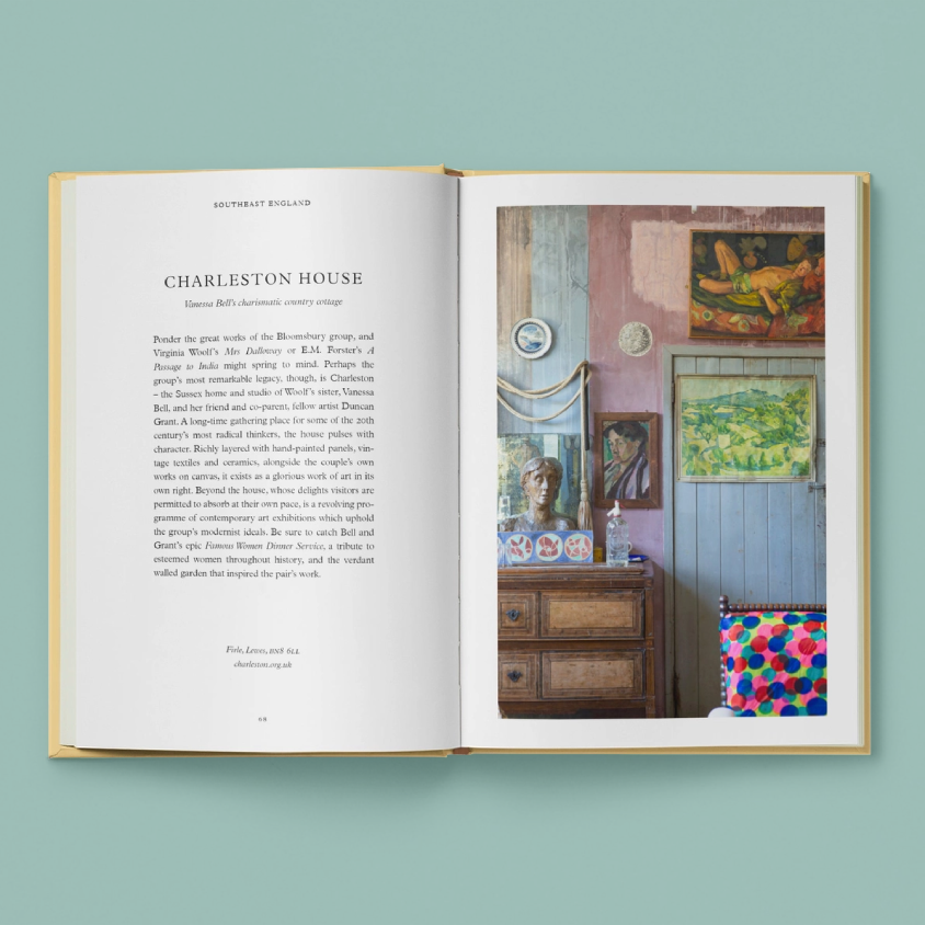 An open book displayed against a solid teal background. The left page contains a printed article titled 'Charleston House' with black text on white paper.