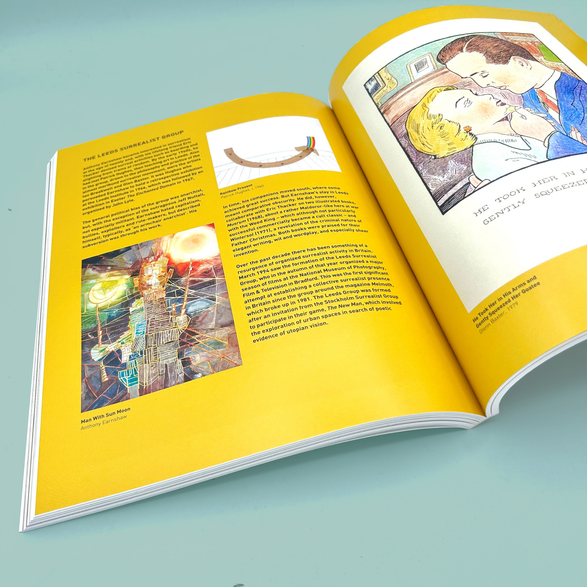 Open book with artistic illustrations and text on a light blue background