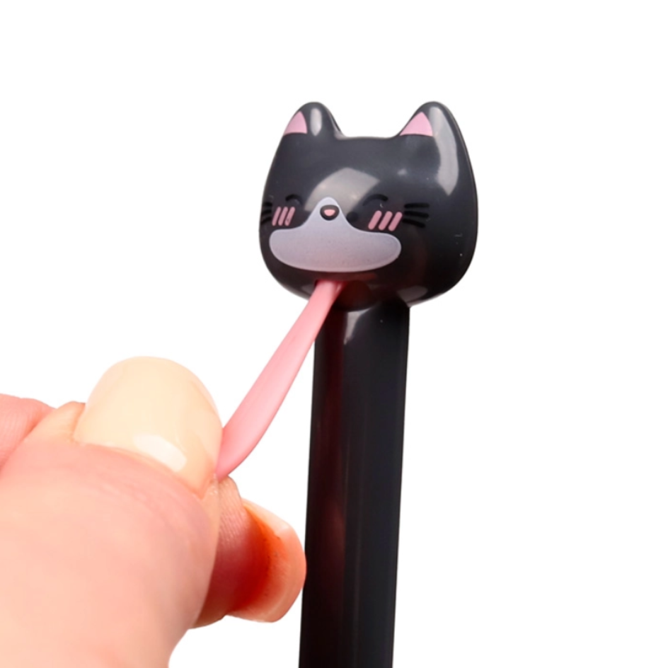 A close-up of a hand holding a black cat-shaped pen with a pink tongue, shown against a plain white background.