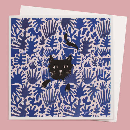 Card with black cat illustration on a blue and pink patterned background