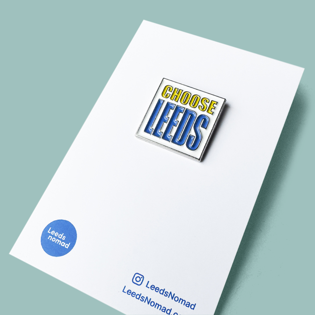 Pin with 'Choose Leeds' text on a white card with branding
