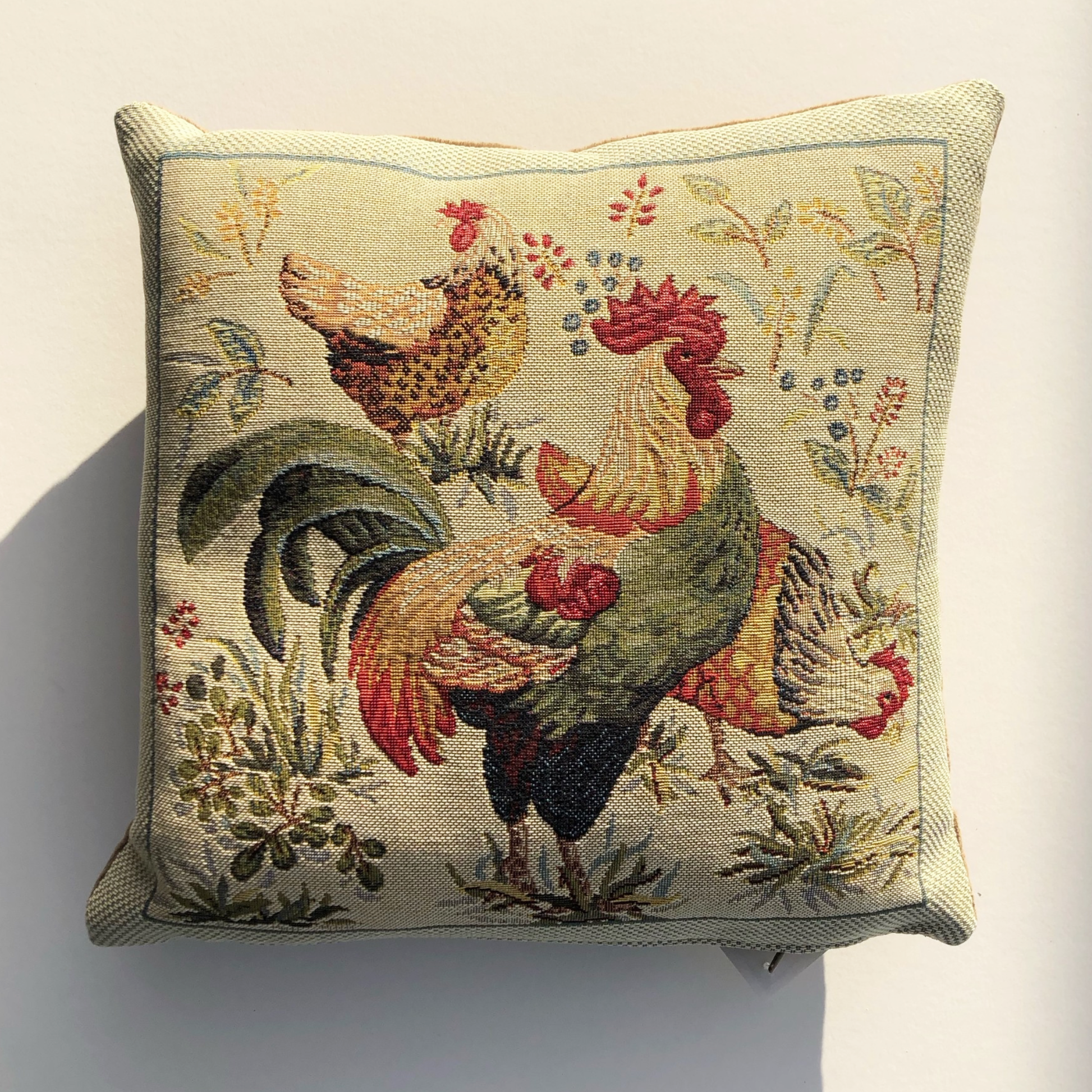 Country hens woven tapestry cushion design on a natural background