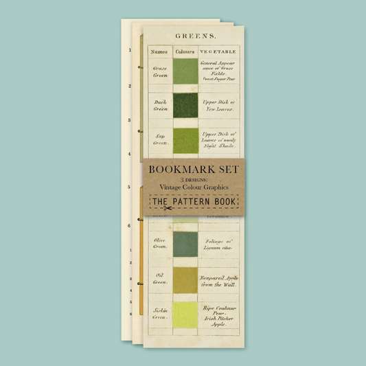 A bookmark featuring green color charts with vegetable names and color swatches, printed on cream-colored paper with a brown band.