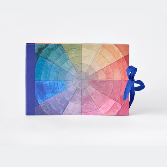Color swatch book with a blue ribbon on a white background