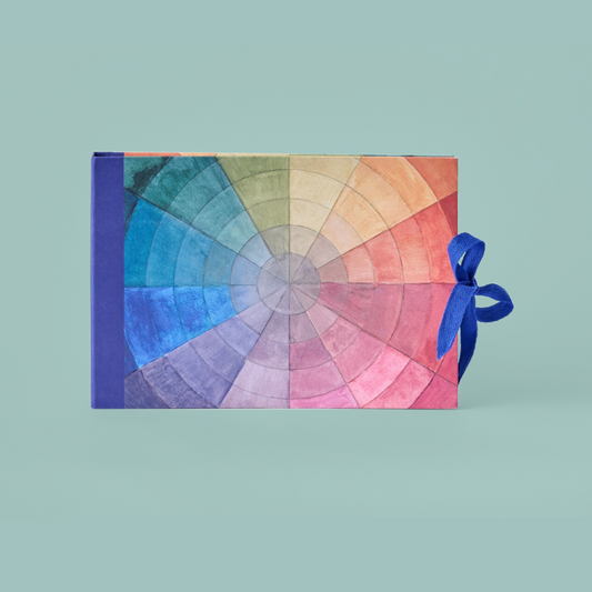 Colour swatch book with a blue ribbon on a white background
