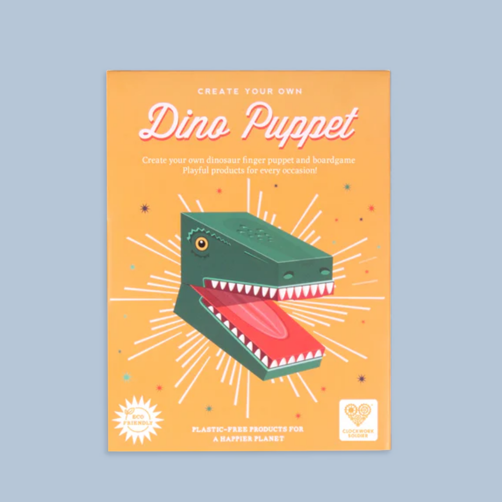 Dino Puppet kit packaging with a dinosaur illustration on an orange background