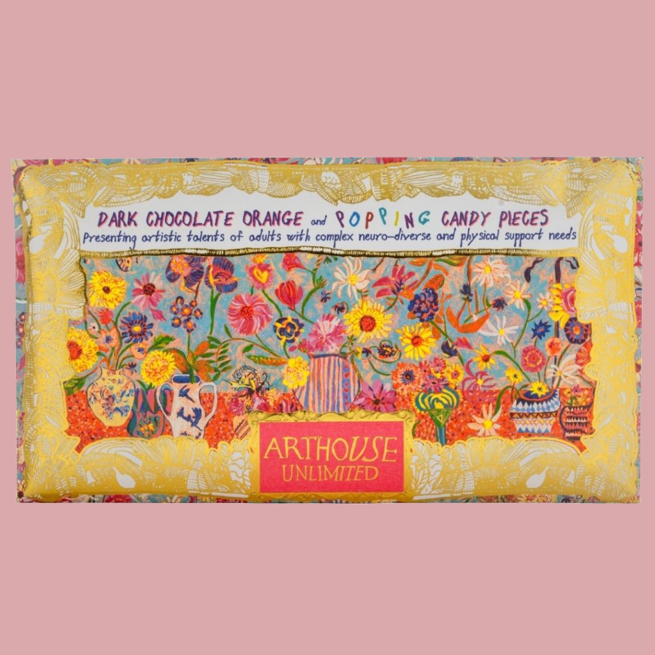 Chocolate bar packaging which is covered in dense floral and whimsical illustrations with text reading 'DARK CHOCOLATE ORANGE and POPPING CANDY PIECES' and an 'ARTHOUSE UNLIMITED' label.