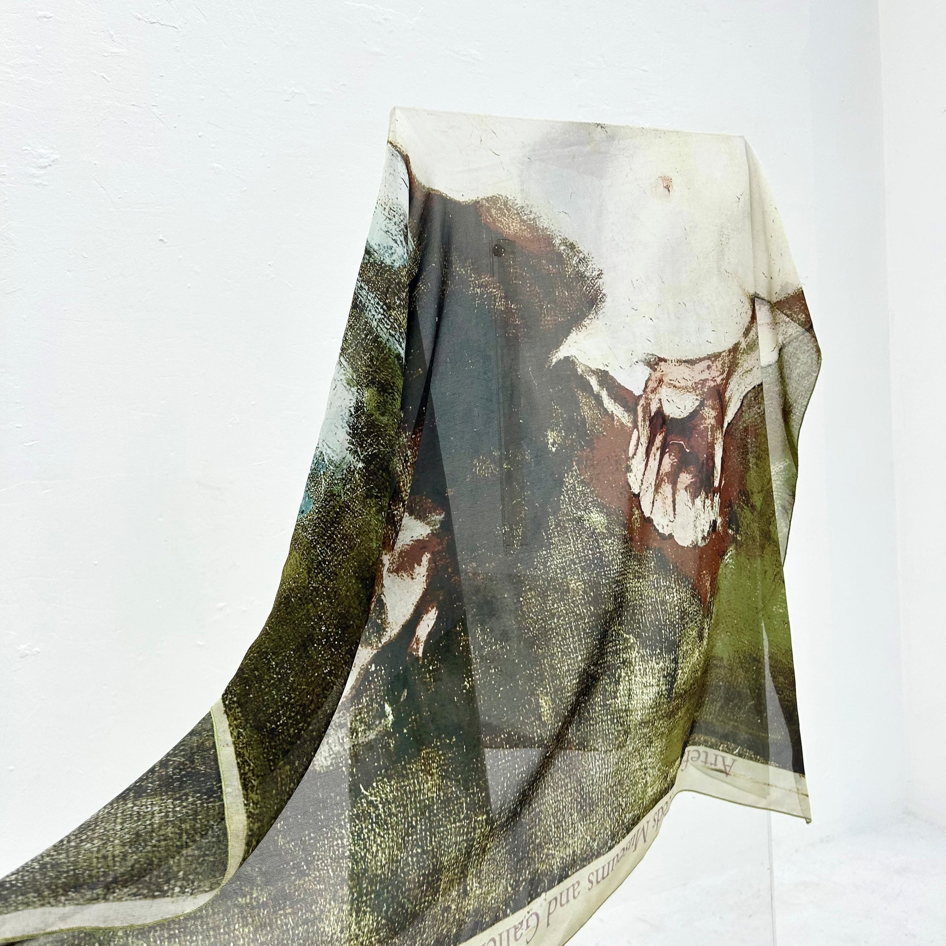 Scarf with a human figure design on a white background