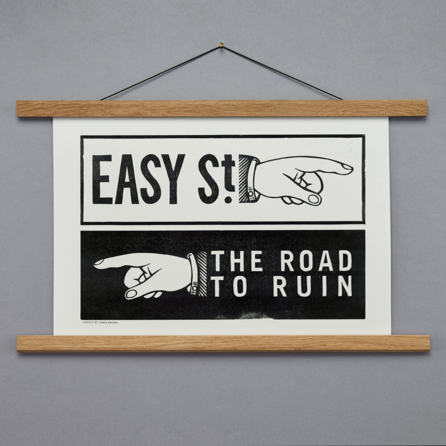Framed poster with hands and text on a gray background