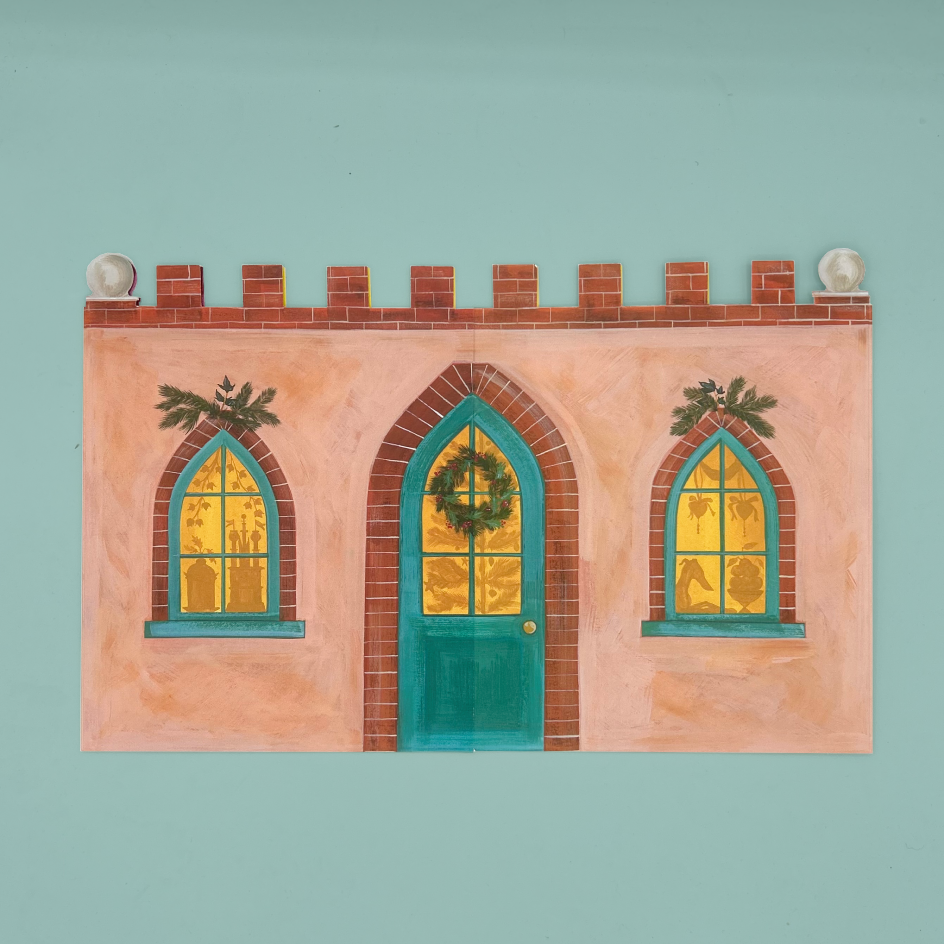 A card advent calendar depicting a whimsical peach-colored building facade with a teal door, two arched windows with yellow-gold panes, brick trim, and greenery, shown against a solid pale aqua background.