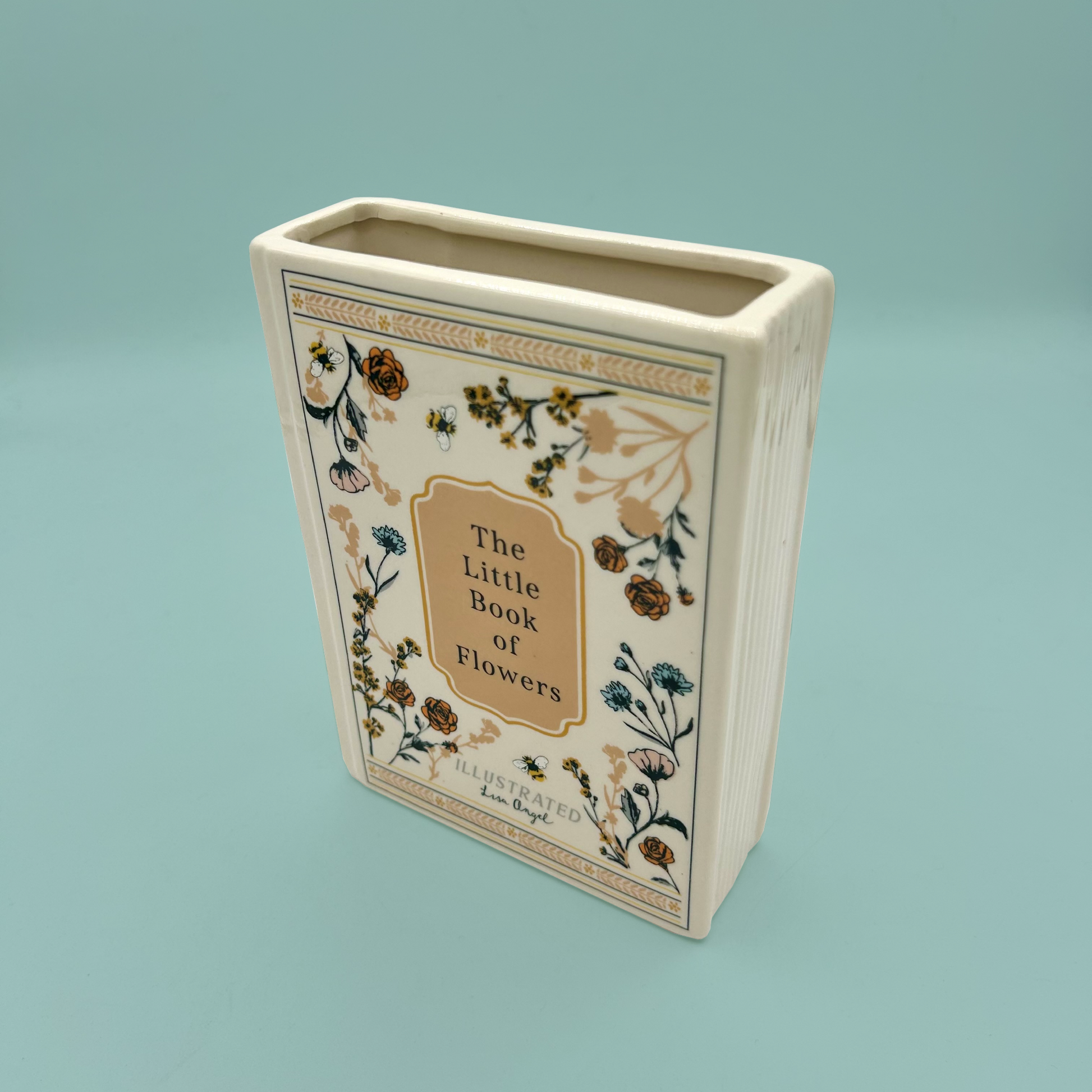 Decorative vase with 'The Little Book of Flowers' design on a light blue background