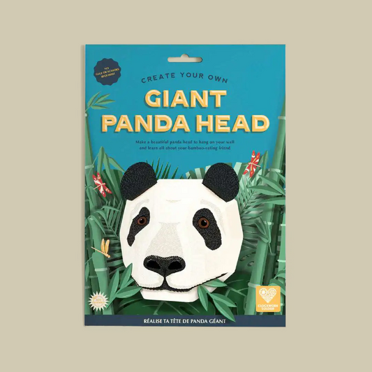 A product package for a craft kit titled 'Create Your Own Giant Panda Head' on a solid beige background. The package features a bright blue background with yellow text and an illustration of a panda head surrounded by green bamboo.
