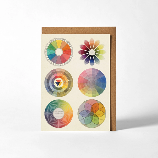 Color swatch chart with six circular color samples on a beige card with a brown border.