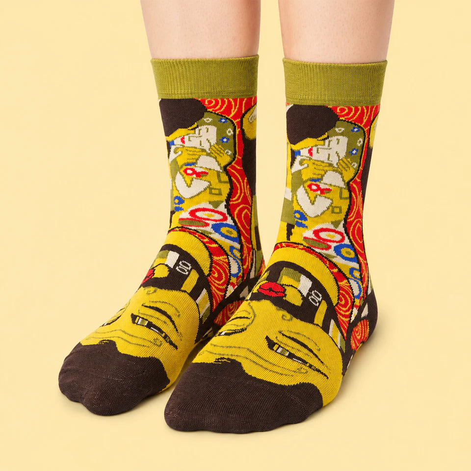 Colorful socks with abstract designs on a beige background