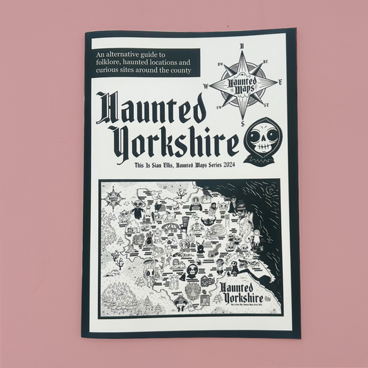 A printed zine titled "Haunted Yorkshire" with gothic typography, a compass rose, a skull emblem, and a black-and-white illustrated map on a pink background.