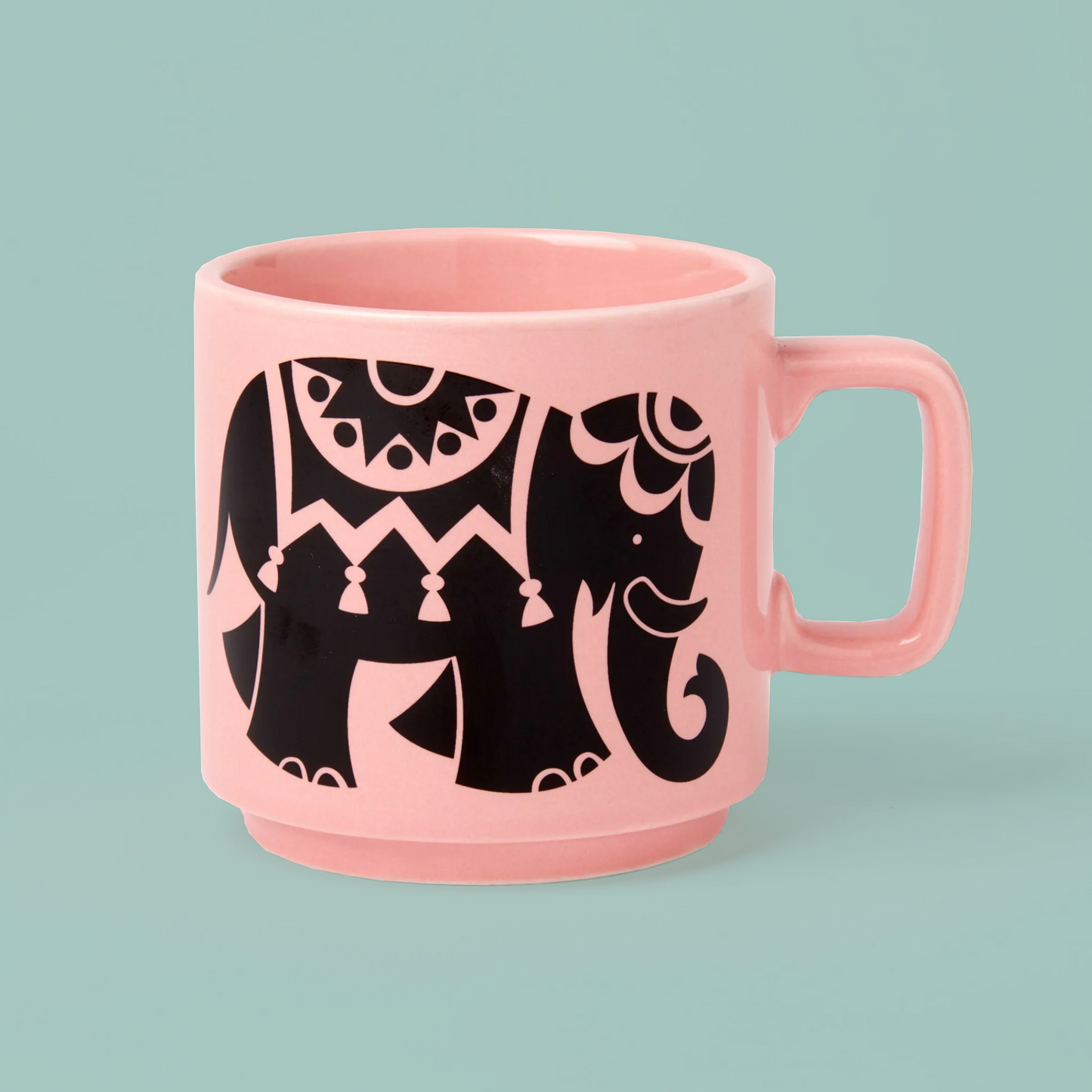 Pink mug with black elephant design on a light blue background