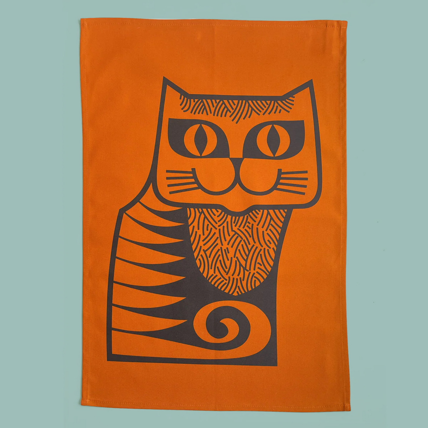 Orange towel with black cat design on a light blue background