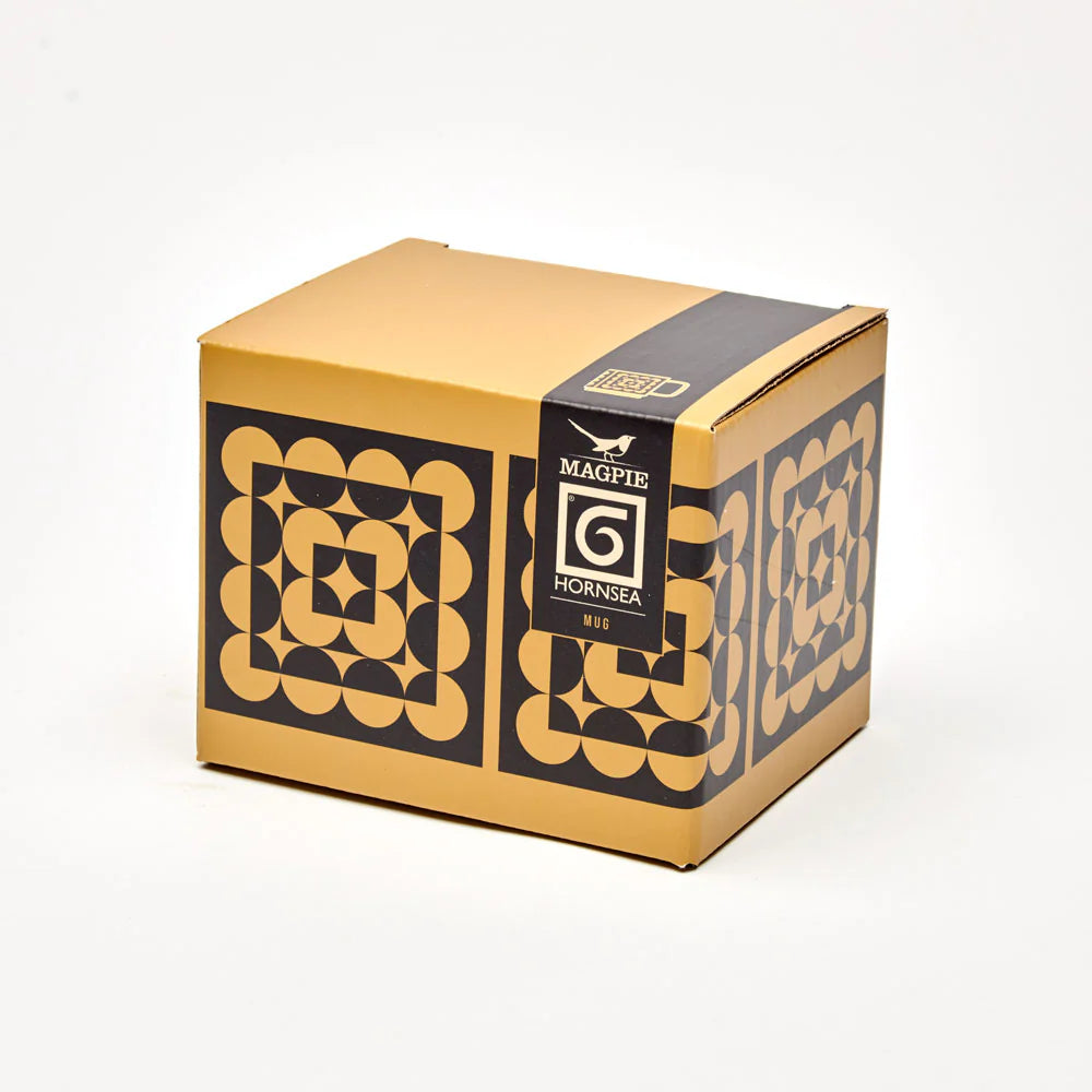 Cardboard box with decorative patterns and 'Magpie Hornsea' branding on a white background