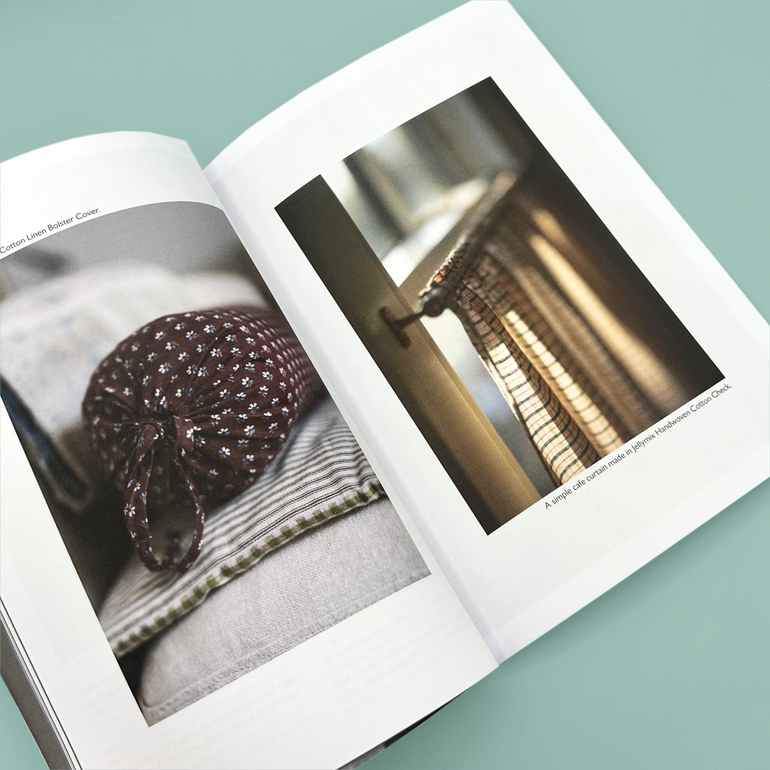 Inside pages of a book that have photographs of a bolster cushion and a set of curtains. 