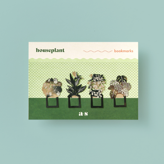 4 steel houseplant-shaped bookmarks on a green and white card. 
